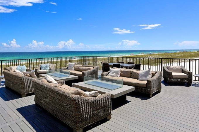 outdoor patio with seating and beach views